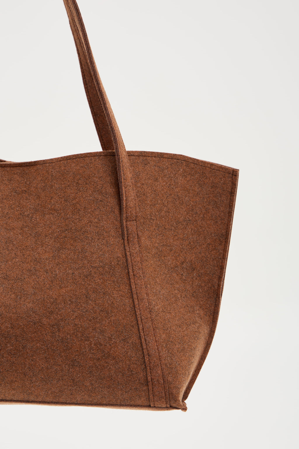Brown tote bag on a light gray background