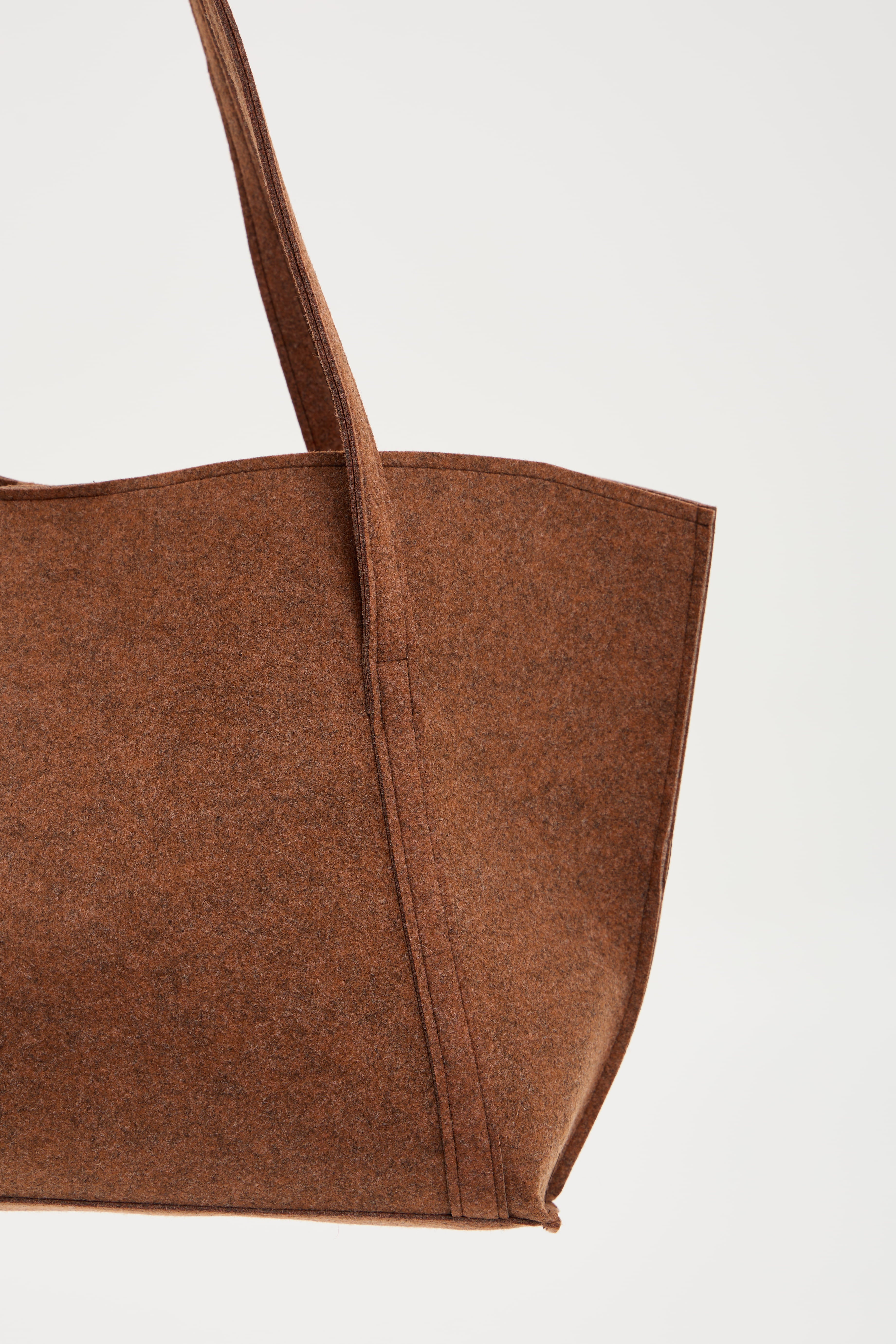 Brown tote bag on a light gray background