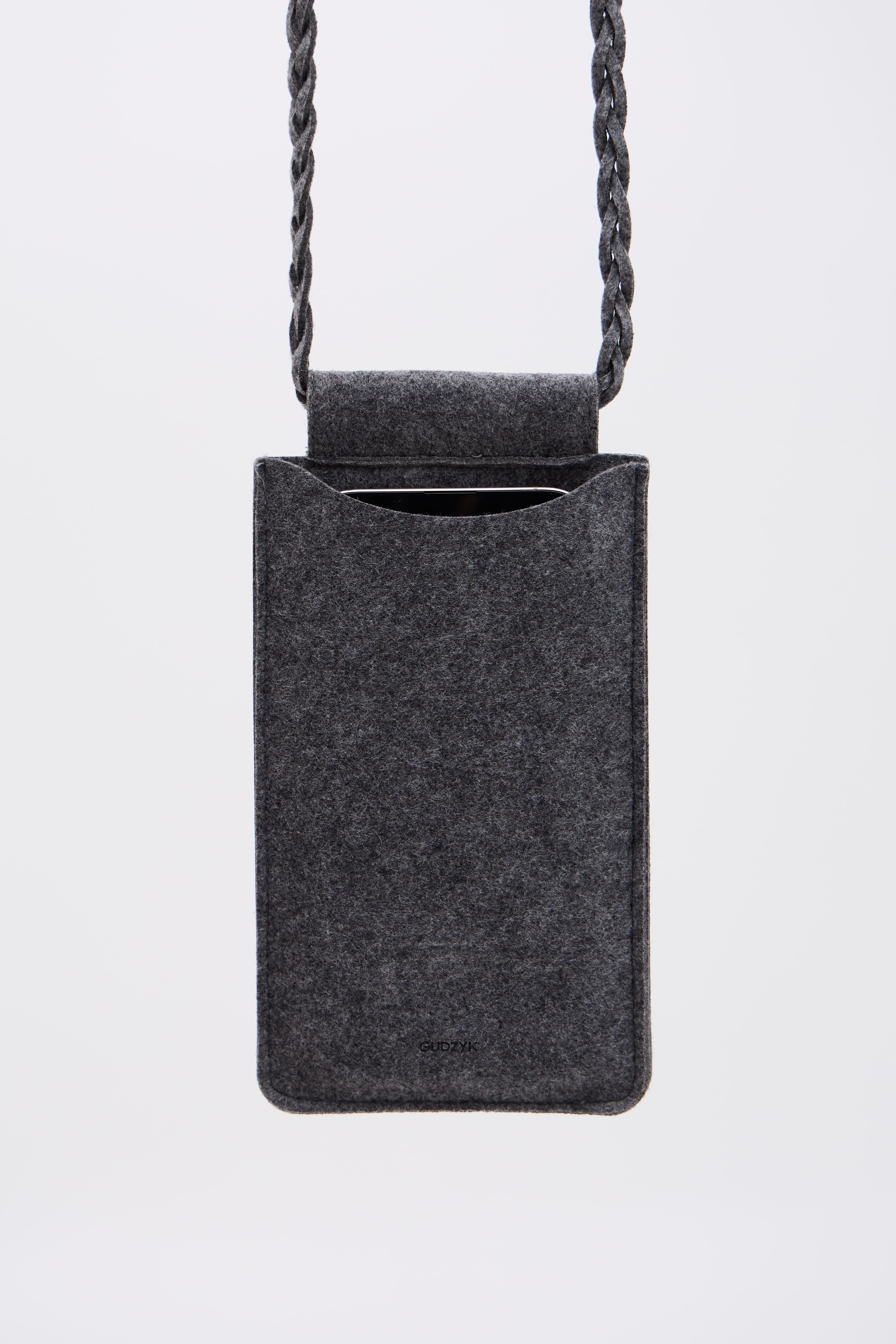 Gray felt bag for phone with a rope handle on a white background