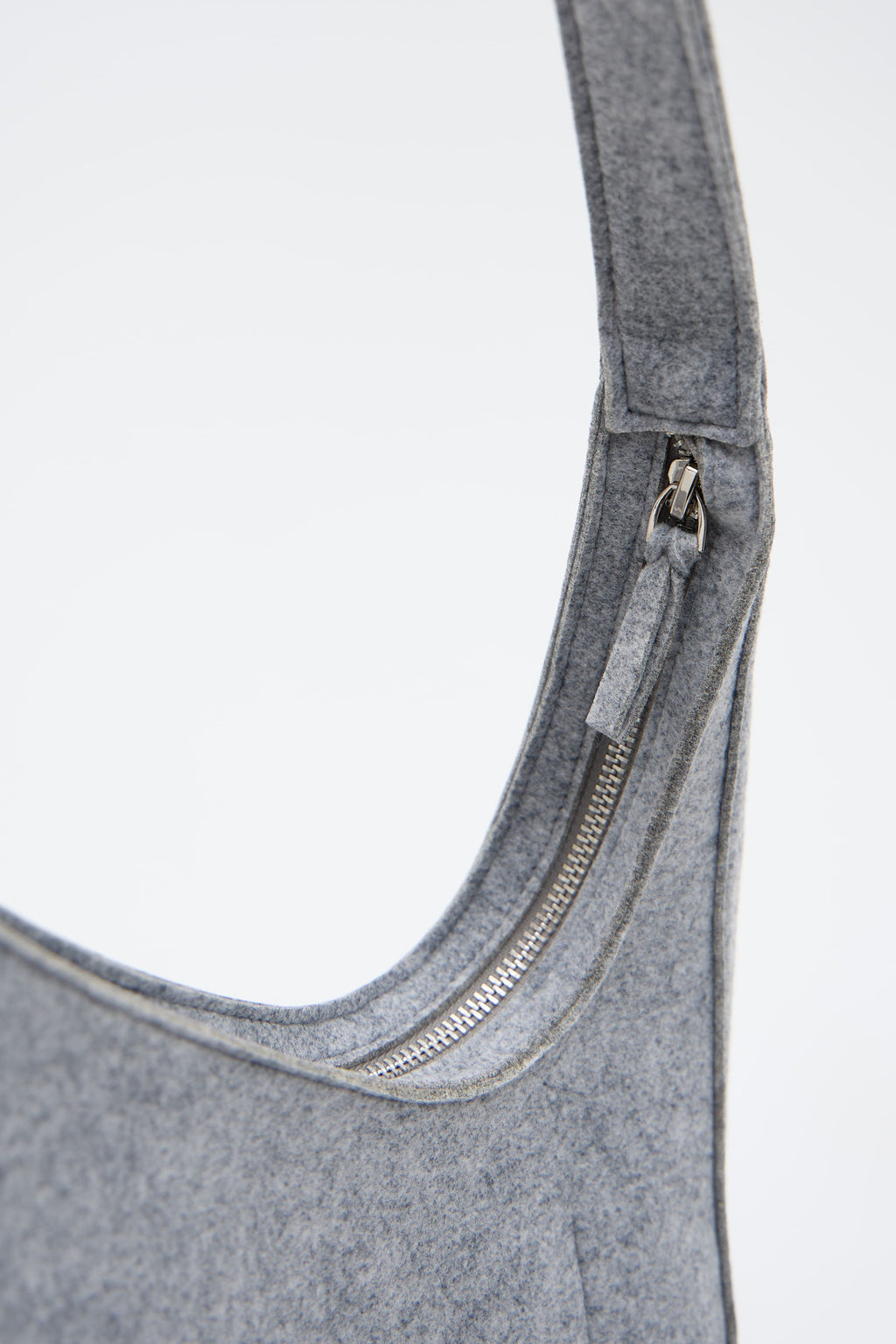 Silver bag with a zipper on a white background