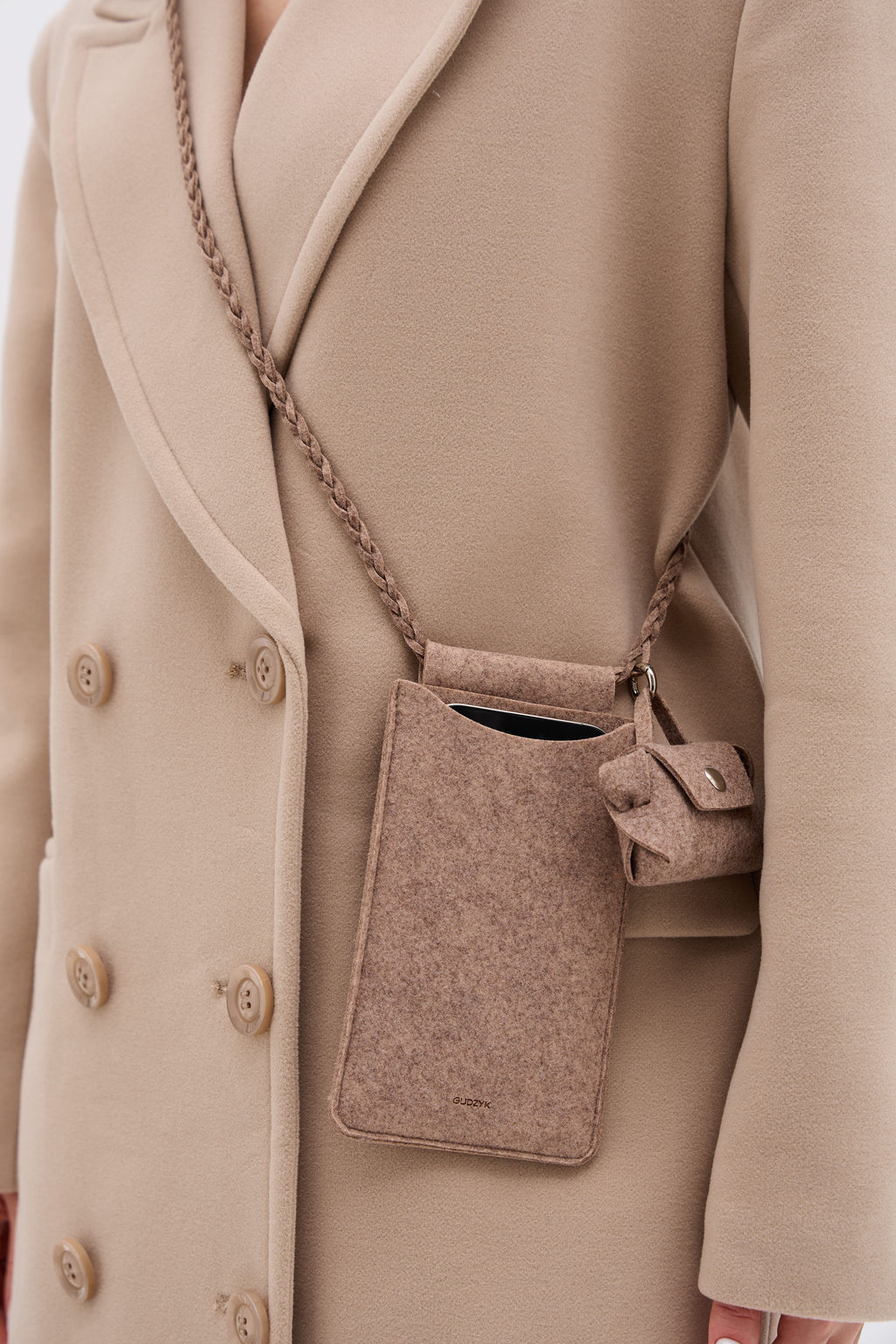 Beige coat with a matching crossbody bag