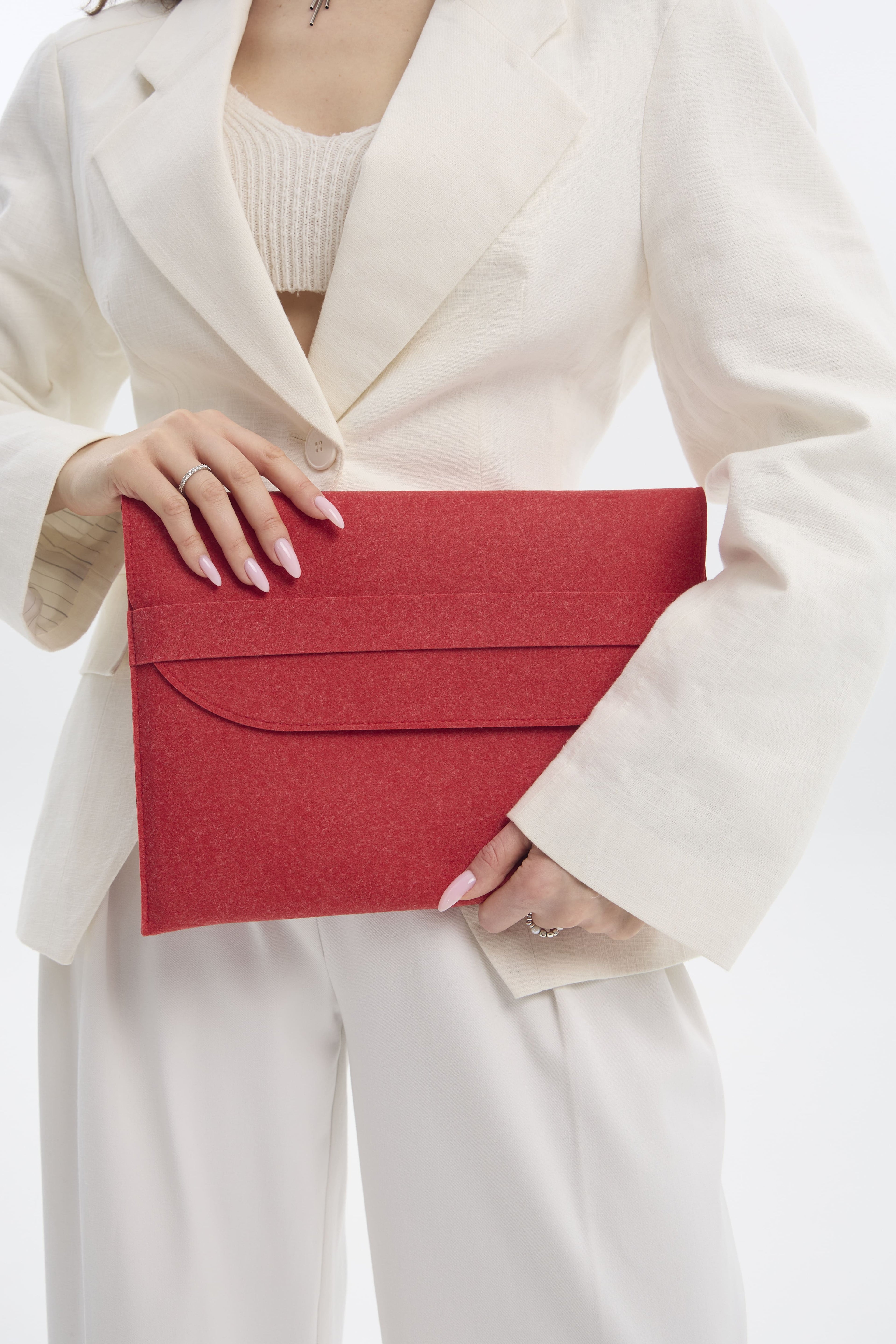 Person holding a red sleeve against a white background